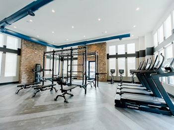 a gym with treadmills and other exercise equipment at The Austin Townhomes, Draper, UT 84020